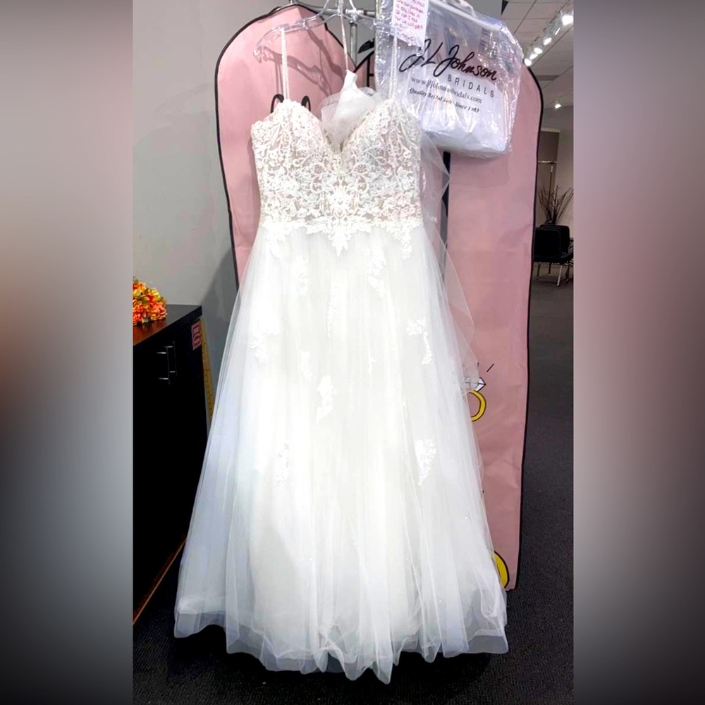 Beautiful wedding dress worn once for a few hours. Retail 1500. Size 18.